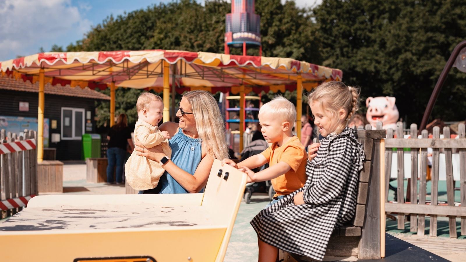 Mum and kids on a ride at Old Macdonald's Farm, Brentwood, Essex